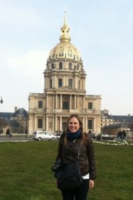 woman in front of domed building